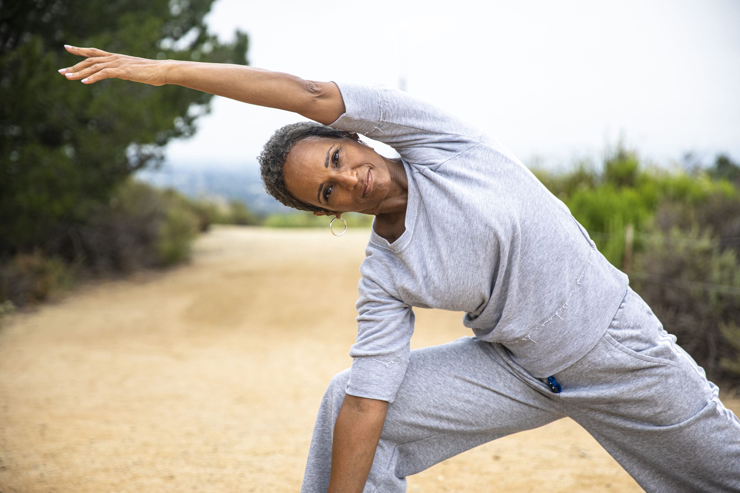 A senior black woman staying fit outdoors